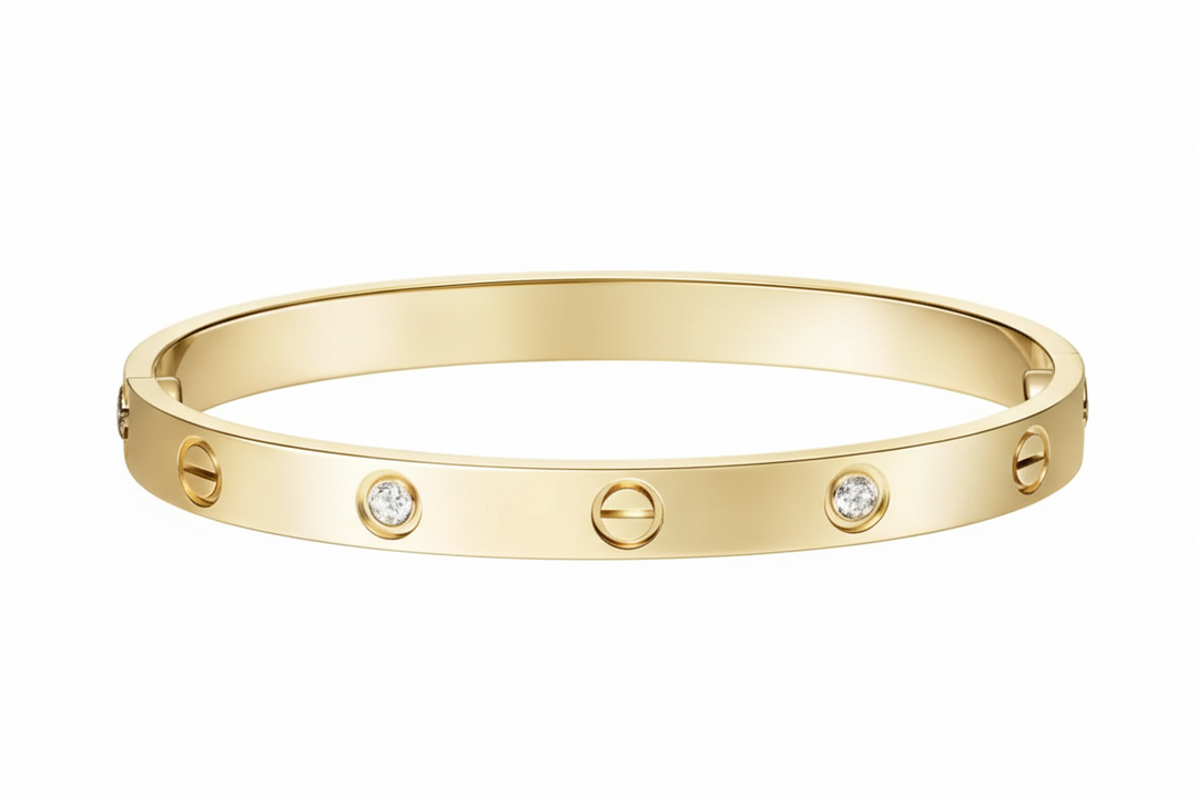 Gold bracelet with diamonds on a light gray background